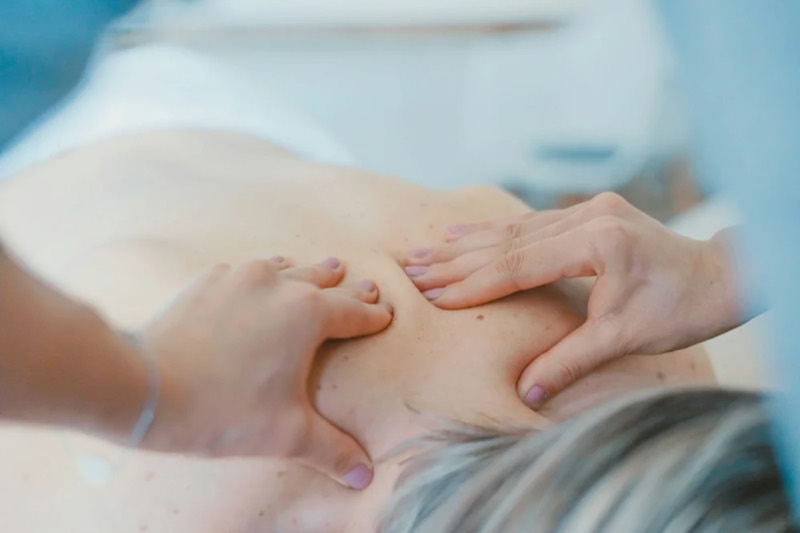 A physiotherapist treating a patient